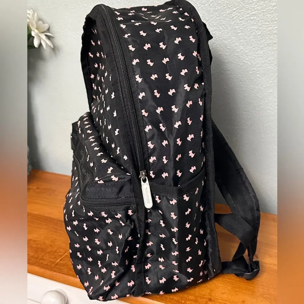 Agatha Paris Black Backpack With Pink Scottie Dog Pattern all over.